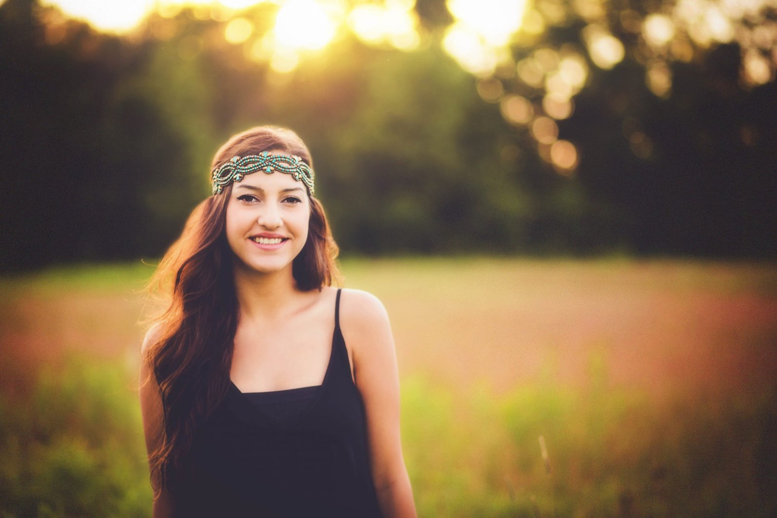 a woman with long hair wearing a bandana