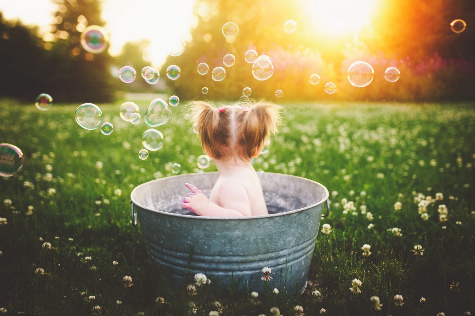 a little girl sitting in a tub filled with bubbles, Newborn & Family Photography Ventura County