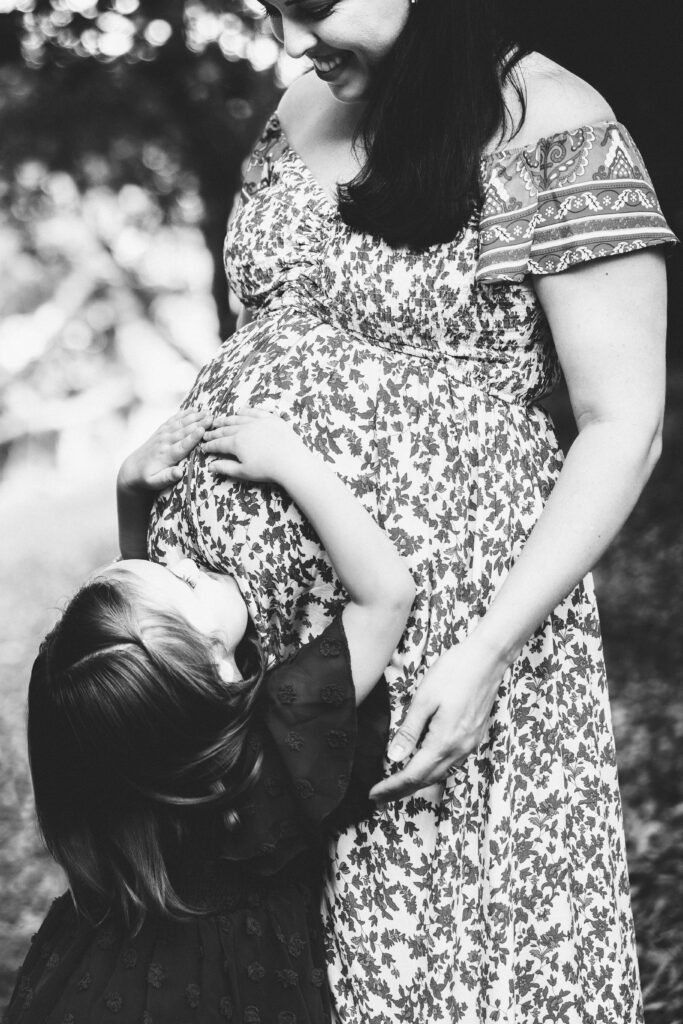 a woman holding a child in her arms